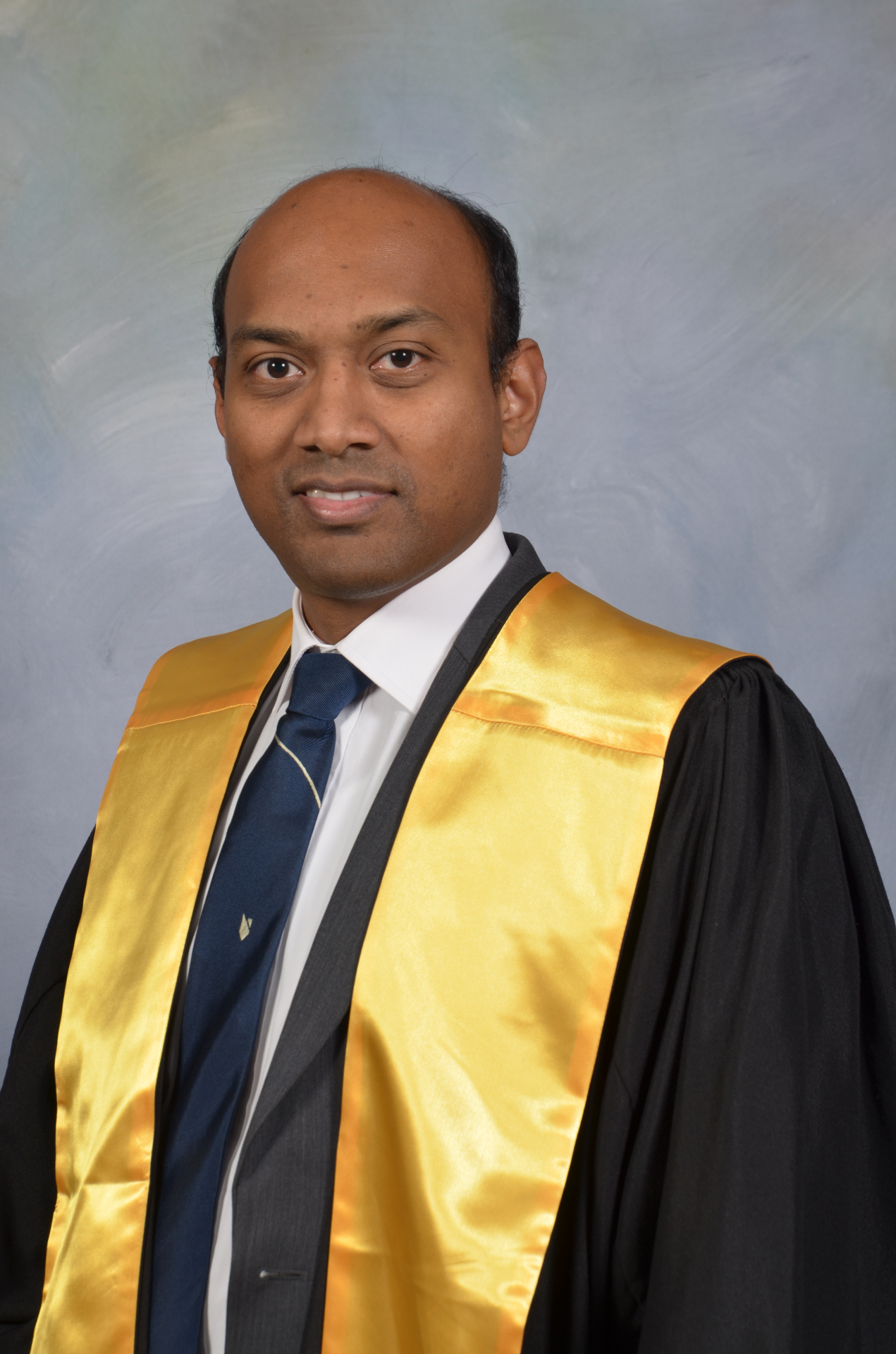 Dr Brendan Dias in academic regalia